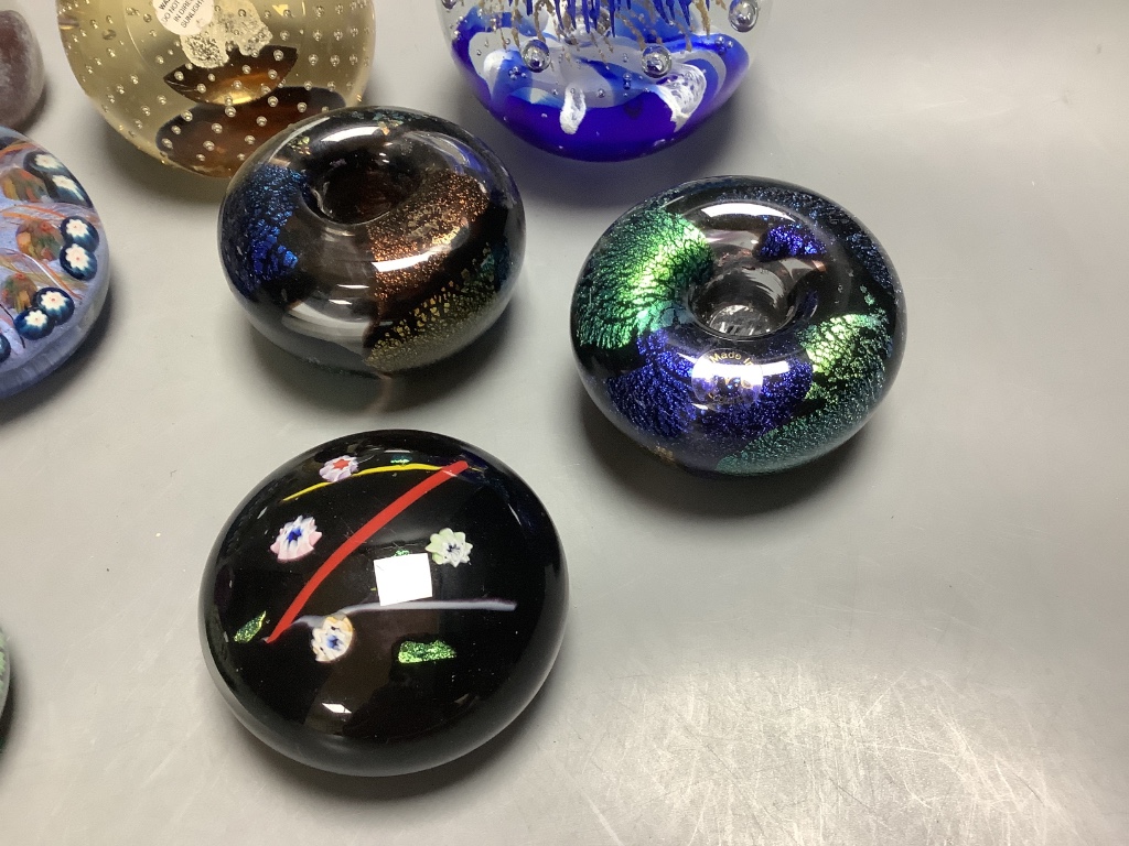 Eleven glass paperweights